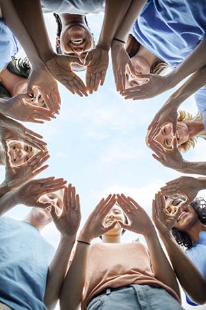 Group of people with their hands together